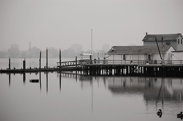 A house sits on a pier.