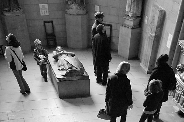 Museum visitors inspect crypts.