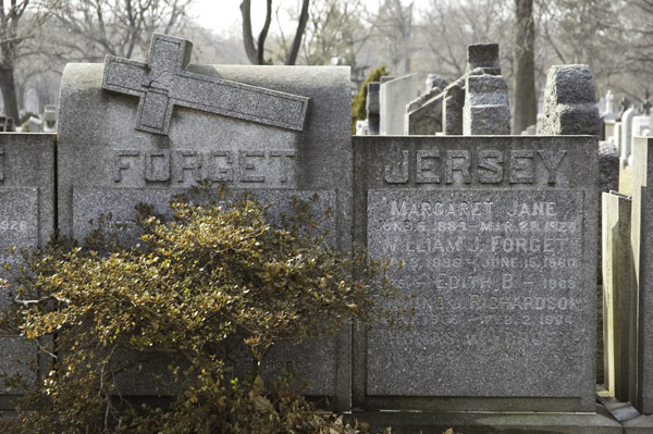 A pair of names on a set of tombstones.