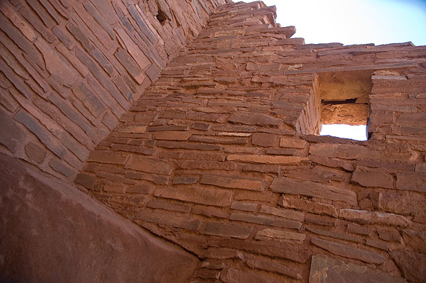 An open roof and open window of an ancient
pueblo.