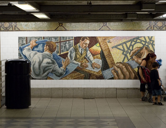 A mother leads a child past a mosaic on a subway mezzanine.