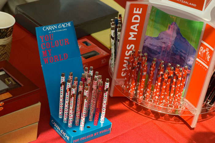 An array of pens proclaims their Swiss manufacture.