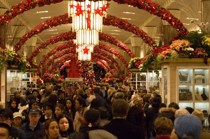 A department store is filled with holiday shoppers.