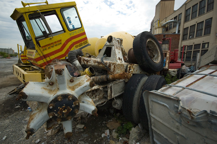 The cab of a cement truck tilts forward at a ridiculous angle, and axle assemblies call out for love.