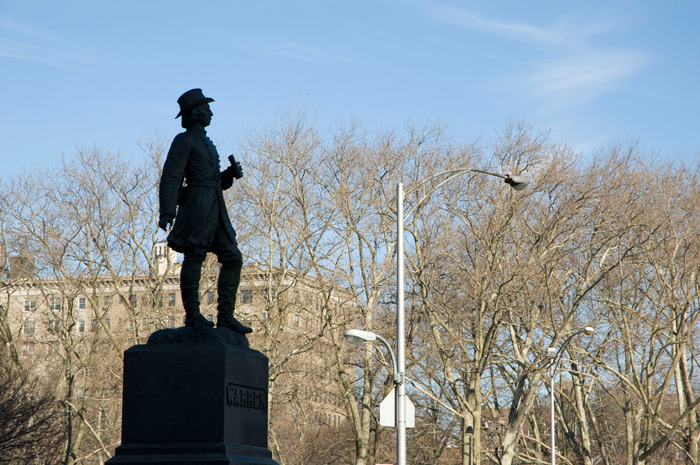 A statue in silhouette of a Union General, holding a small telescope.