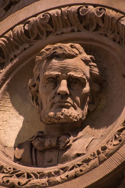 Face of Abraham Lincoln, in terra cotta on the side of a building.