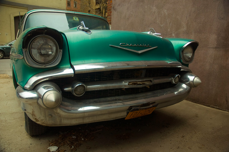 An old Chevrolet, with huge headlights and cones.