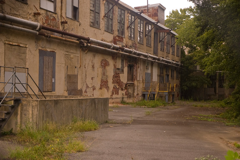 An old plant, with loading areas, and the building in decay.
