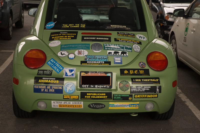 A car covered in Harry Potter bumper stickers.