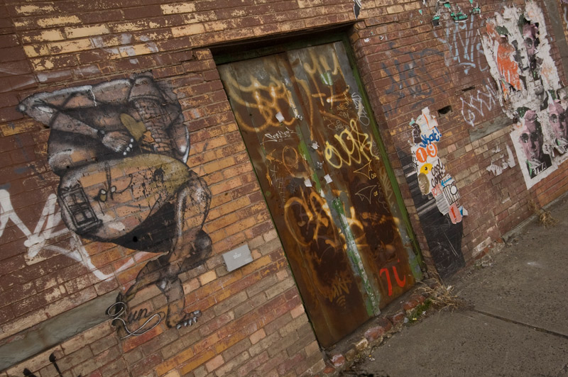 A variety of painting, wheat paste, and graffti street art.