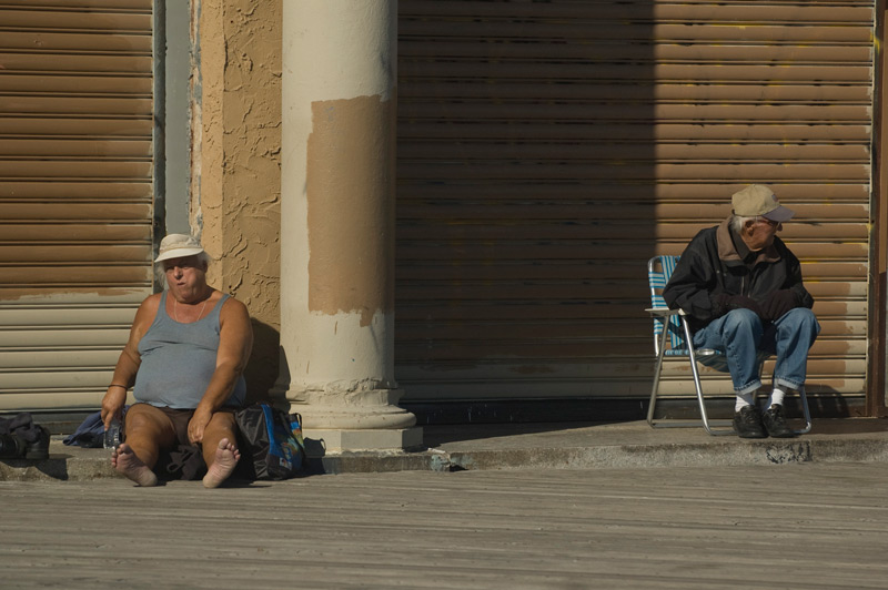 Two older men relaxing in the sun.