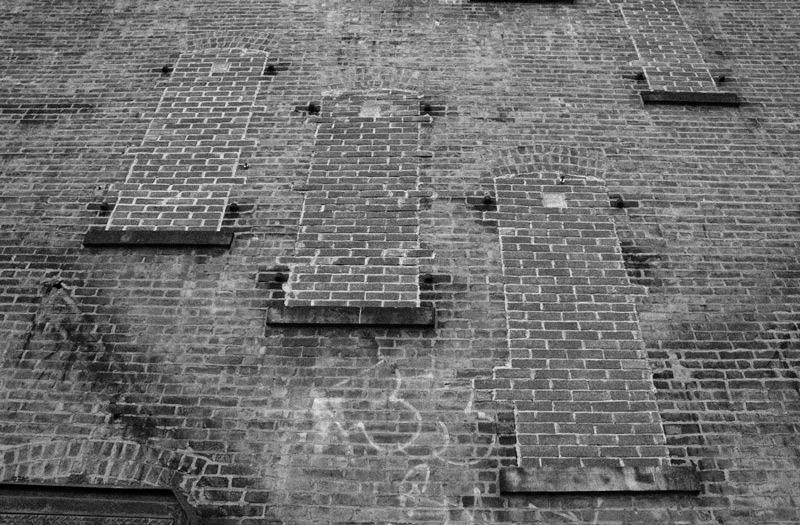 A wall, with bricks where there were once windows