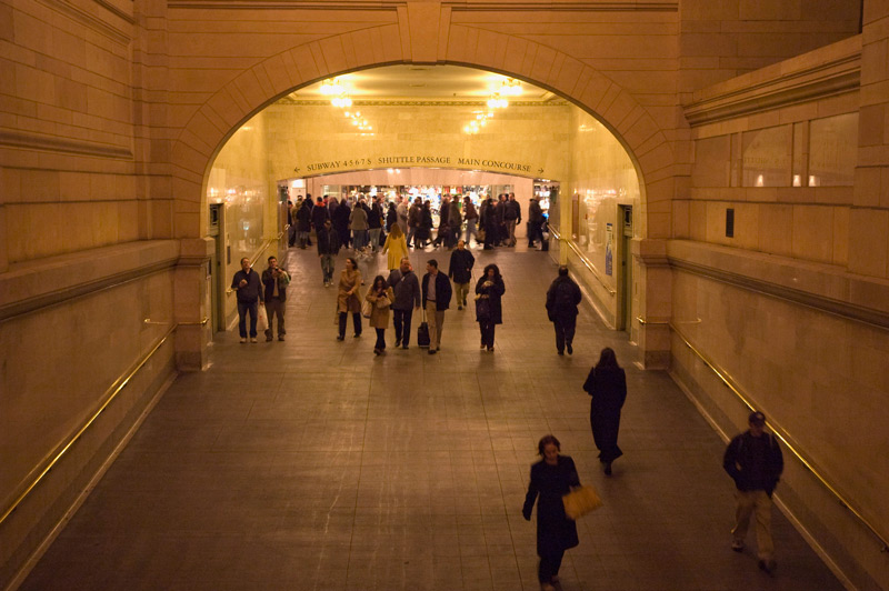People walking in a passage way in Grand Central.