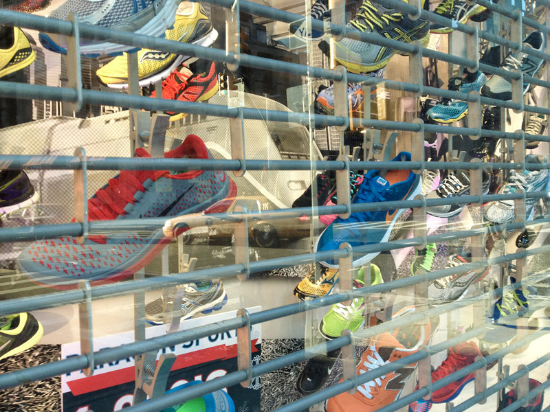 Sneakers hanging in a store window