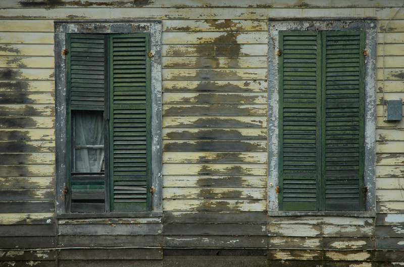 Wood shutters on a decrepit building