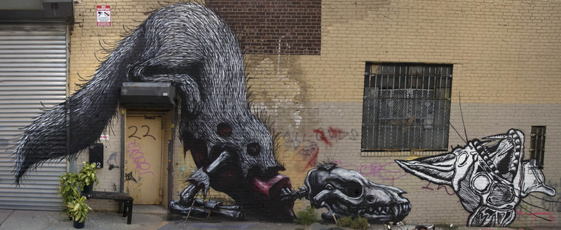 A mural showing a weasel eating a carcass.