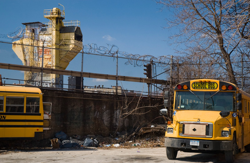 A school bus and a cement factory.