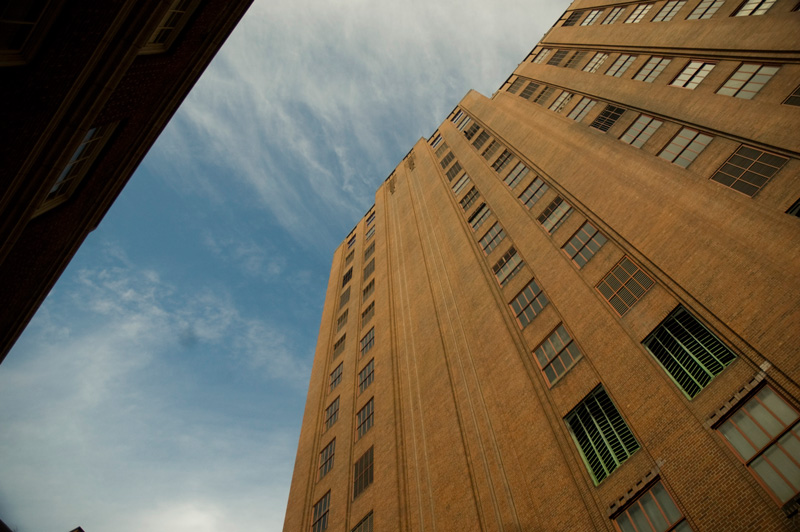 A slice of sky between two buildings.