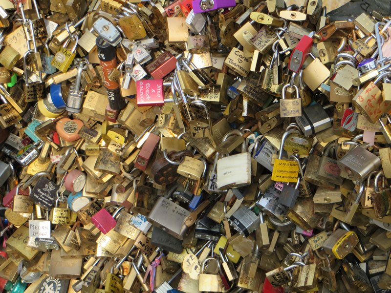 Hundreds of padlocks, inscribed with couples' names.