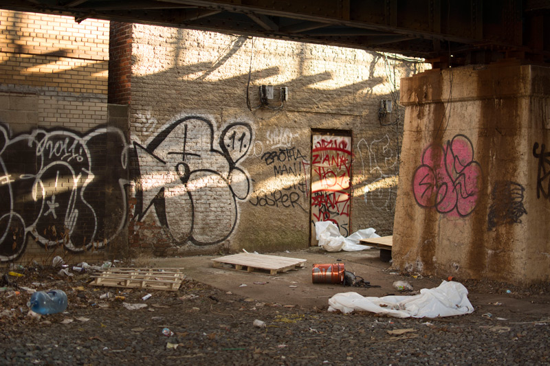 Graffiti below the elevated tracks of a subway