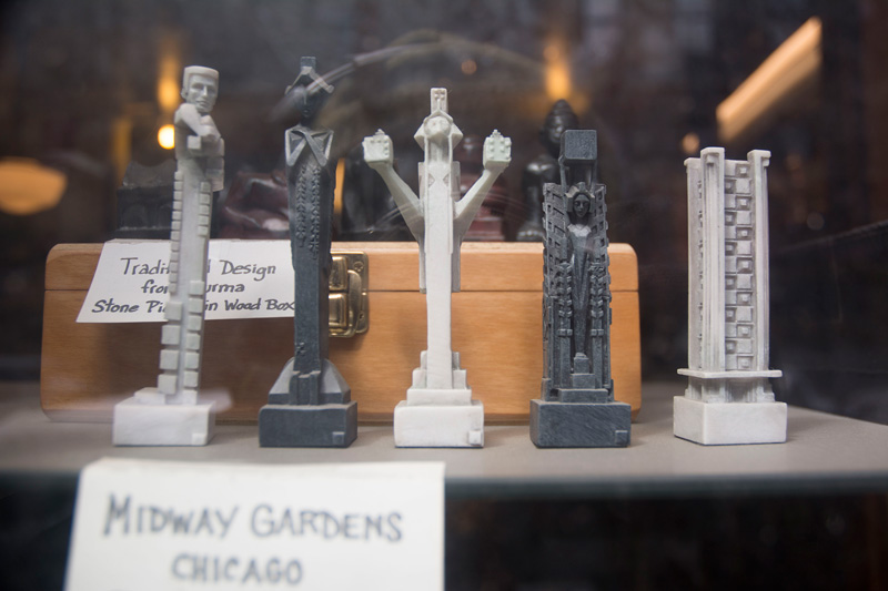 Chess pieces based on statues in Frank Lloyd Wright's Midway Gardens.