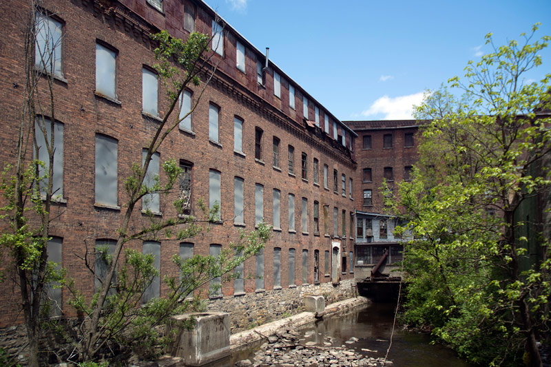 An old factory, its windows sealed off.