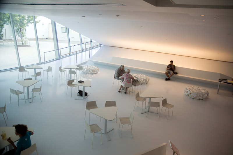 A mostly empty café in a white space.