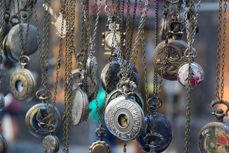 Pocket watch fobs, on chains.