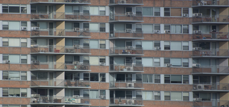 Balconies on a tightly clustered apartment building.