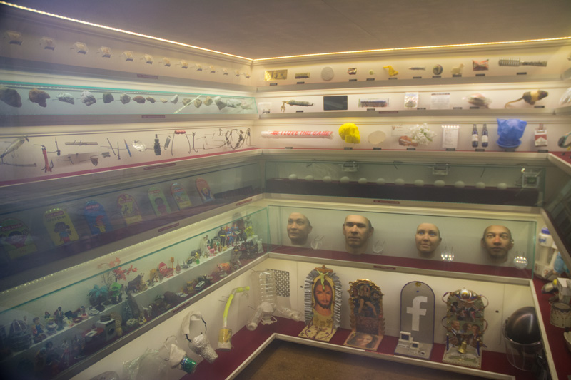 Showcase of objects in a small, closet-sized museum.