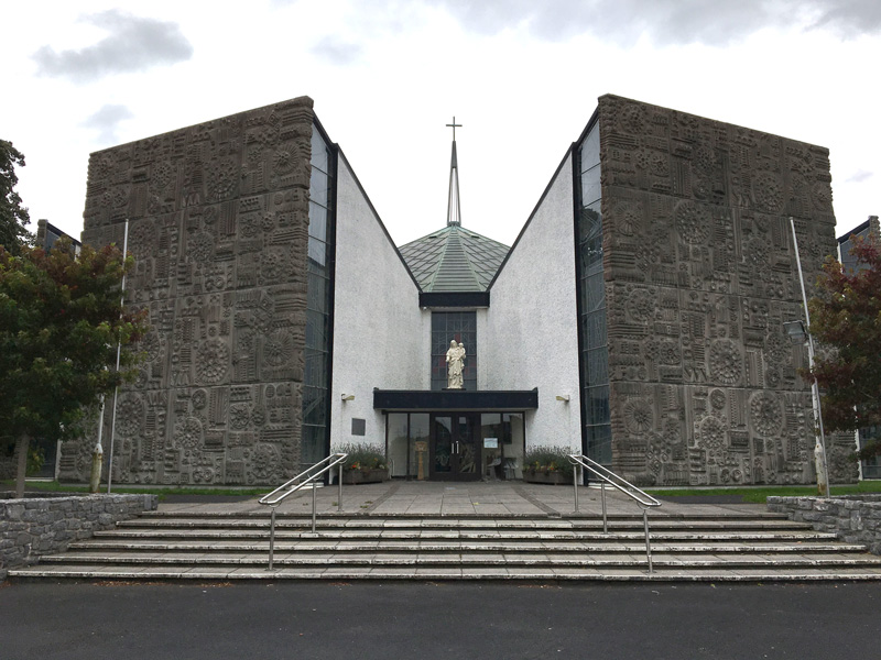 A modern church, with wings looking like bookcase speakers.