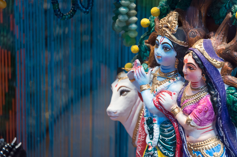 Figurines of Indian deities brighten a store window.