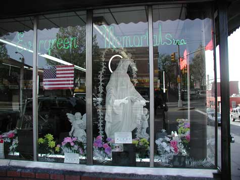A store selling
tombstones and statues. Picture includes a large statue of Mary.