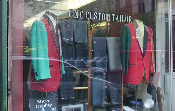 The window of a custom
tailor shows jackets made of wildly different colored fabrics.