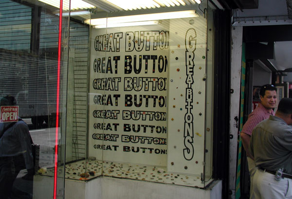 A button
wholesaler's window has various buttons sprinkled throughout the
words 'Great Buttons.'