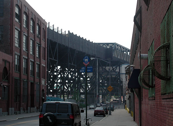An elevated
train's supports, seen down a street.