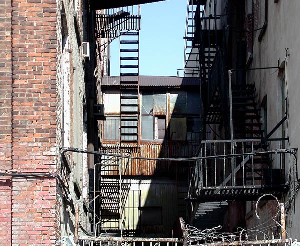 Upper floors of an alley, with rust and similar
signs of age.