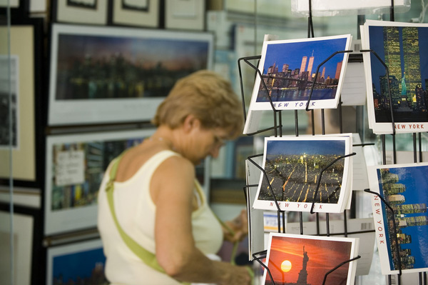 A tourist enters a shop selling postcards and framed
pictures of New York