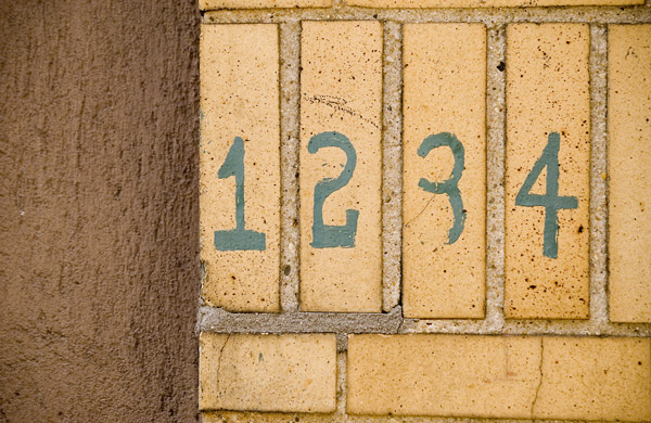 Numbers on bricks count: one, two, three, four.