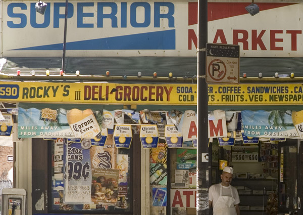 A typical Brooklyn bodega is covered in advertisements.