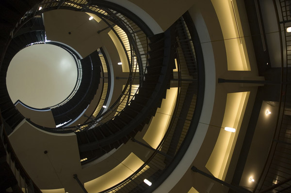 A spiral staircase engulfs the view, leading to a dome.